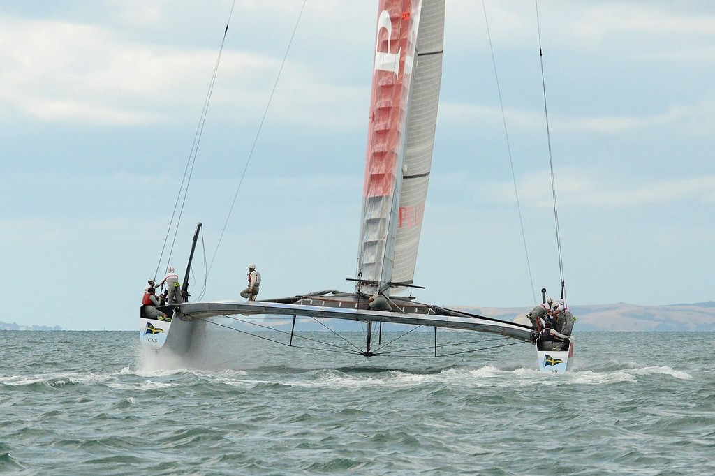 Luna Rossa is through the gybe and starting to accelerate. She has dropped off her foils in the gybe. Port foil is fully raised  - Emirates Team NZ and Luna Rossa Race Training - March 6, 2013 © Sail-World.com NZL http://www.sail-world.com/nz
